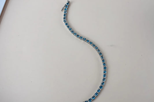 Swiss Blue Topaz tennis bracelet in 925 silver with cubic zirconia