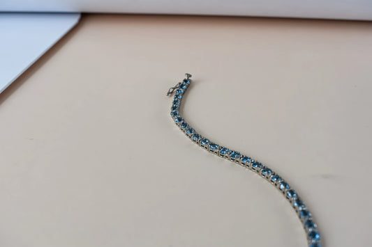 Swiss Blue Topaz tennis bracelet in 925 silver with cubic zirconia
