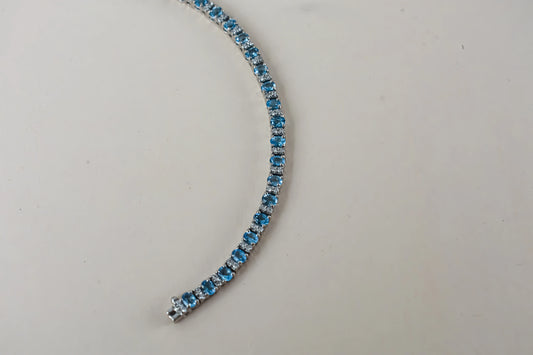 Swiss Blue Topaz tennis bracelet in 925 silver with cubic zirconia