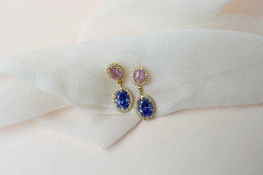 Gold drop earrings with pink and blue sapphire diamond halos