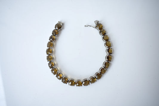 Round-cut beer quartz tennis bracelet in 925 silver with fold-over clasp
