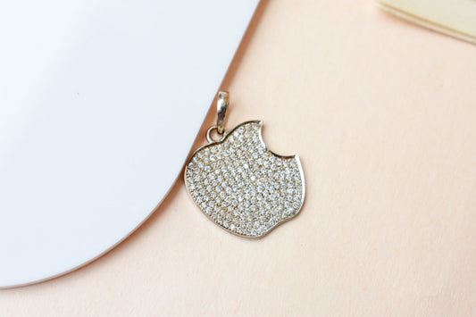 14K gold pendant with moonstone disc and trillion peridot accent