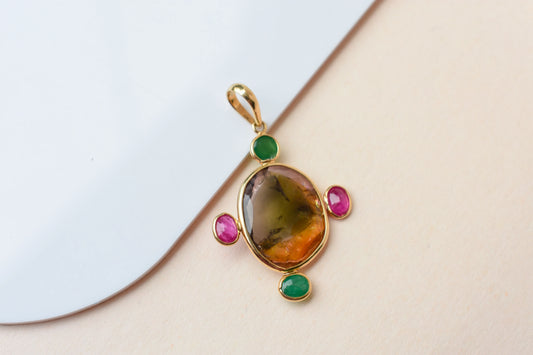 18K gold cross pendant with tourmaline, ruby, and emerald