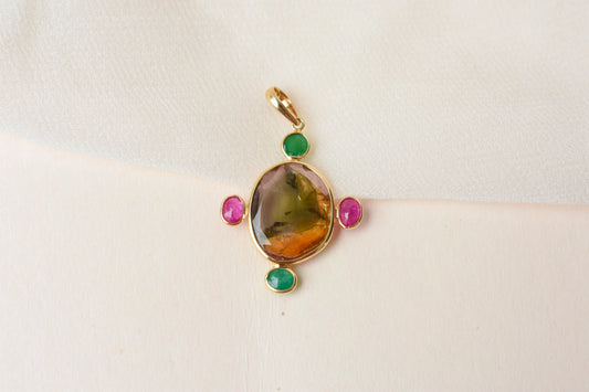 18K gold cross pendant with tourmaline, ruby, and emerald
