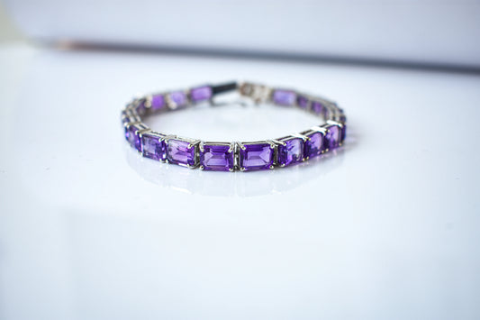 Deep purple emerald-cut gemstone tennis bracelet in 925 silver