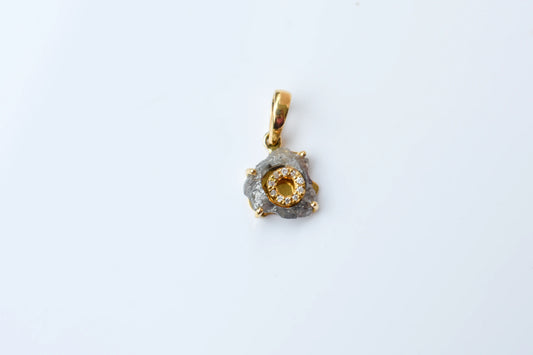 18K gold pendant with rough diamond crystal and pavé diamond halo