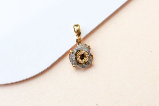 18K gold pendant with rough diamond crystal and pavé diamond halo