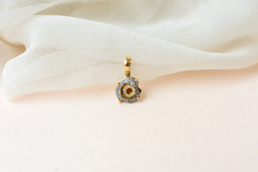18K gold pendant with rough diamond crystal and pavé diamond halo