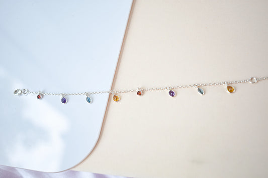 Multi gemstone dangle bracelet with pear-cut colored stones on a 925 silver chain