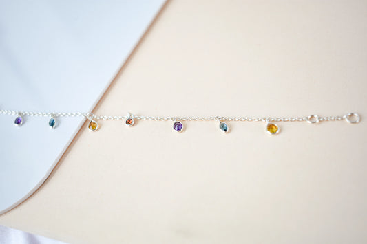 Multi gemstone dangle bracelet with pear-cut colored stones on a 925 silver chain