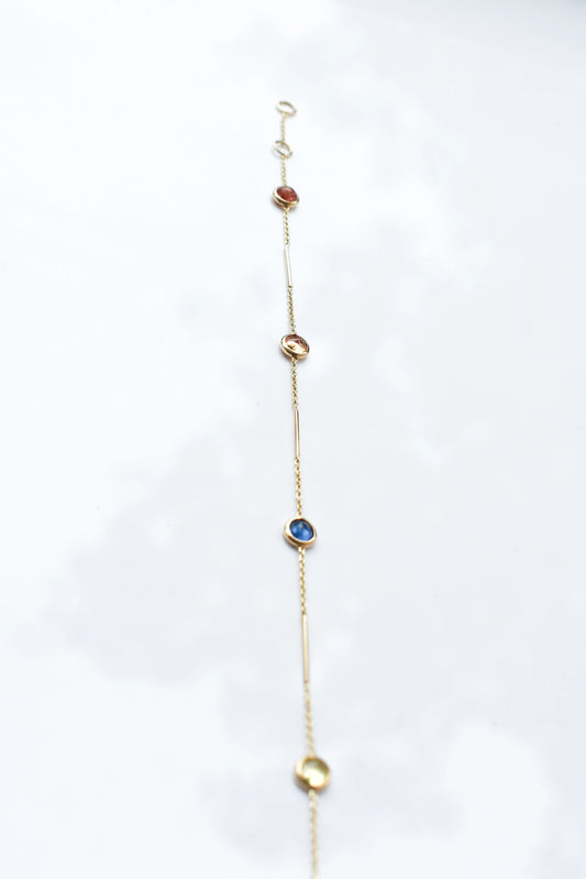 14K gold bracelet with rainbow sapphire bezels and bar links