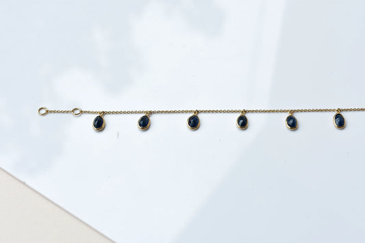 18K gold bracelet with blue sapphire drops in fringe design