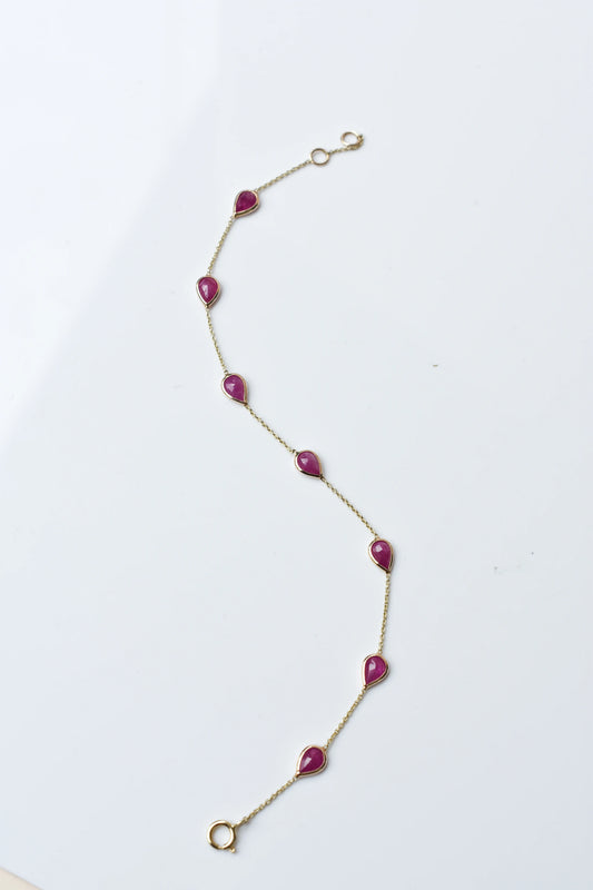 10K gold bracelet with pear-cut ruby drops