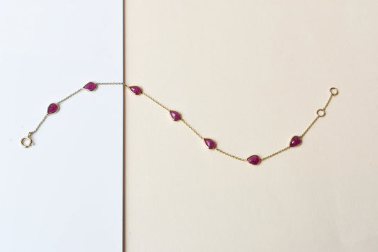 10K gold bracelet with pear-cut ruby drops