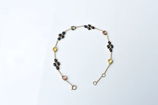 18K gold bracelet with blue sapphire clusters and multi-color sapphire accents