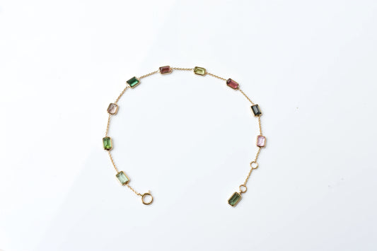 18K gold bracelet with emerald-cut pink and green tourmaline stations
