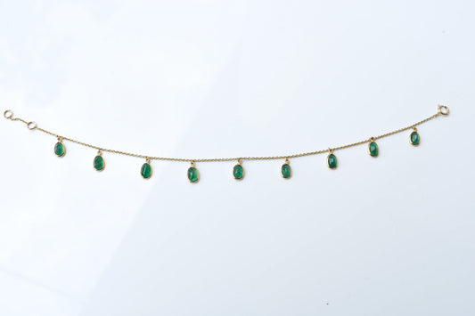 18K gold bracelet with oval emerald drops in fringe design