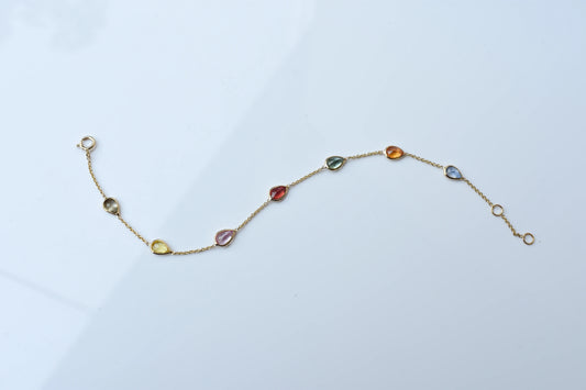 18K gold bracelet with pear-cut multi-color sapphire stations