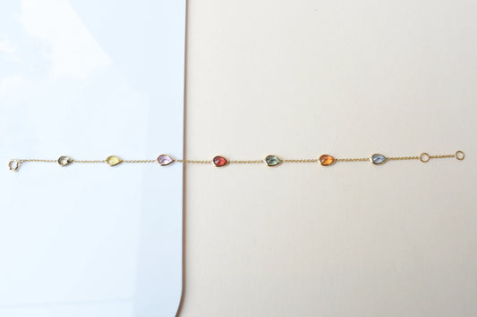18K gold bracelet with pear-cut multi-color sapphire stations