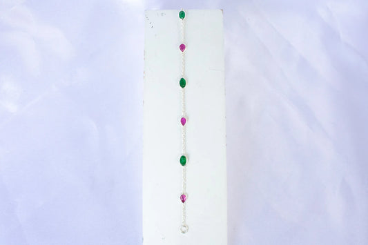 925 silver station bracelet with bezel-set pear-cut rubies and oval-cut emeralds
