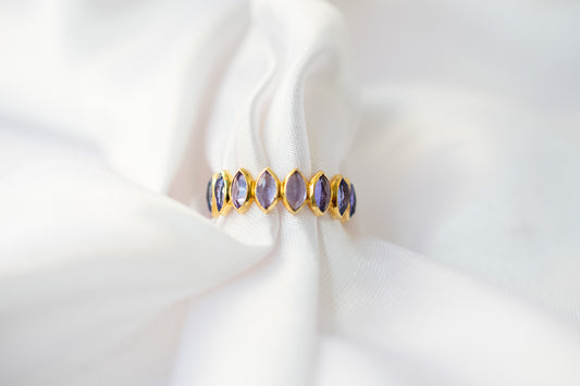 Marquise-cut tanzanite gemstone eternity ring in 14K gold with bezel setting