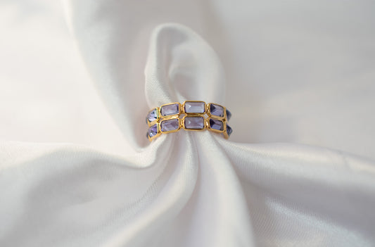 Baguette-cut tanzanite double-row eternity ring in 18K gold with bezel setting