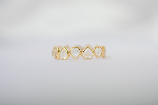 Heart-cut rainbow moonstone gemstone eternity ring in 18K gold with bezel setting