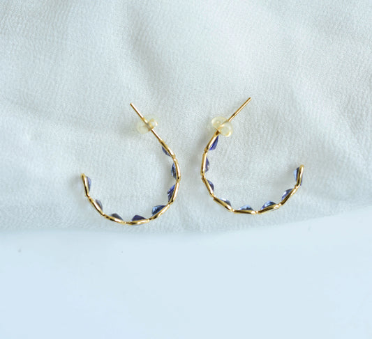 18K gold hoop earrings with graduated pear-cut tanzanite