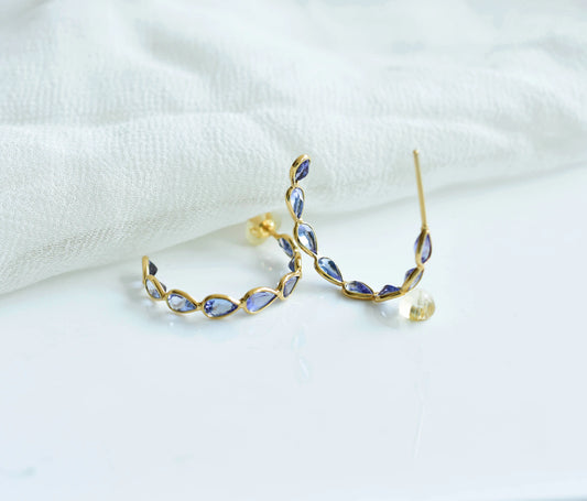 18K gold hoop earrings with graduated pear-cut tanzanite