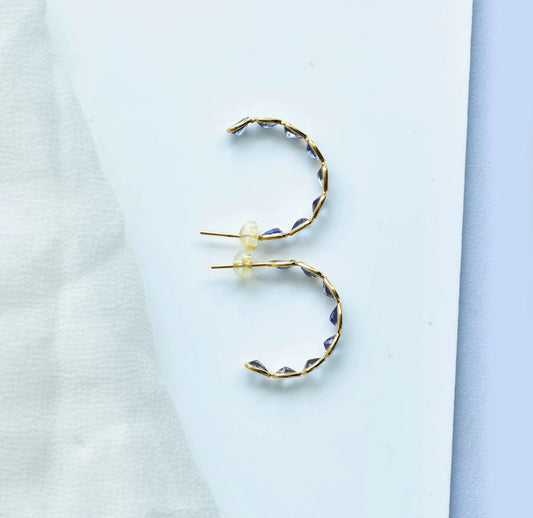 18K gold hoop earrings with graduated pear-cut tanzanite