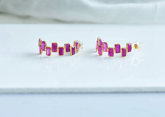 18K gold ear climbers with staggered baguette-cut rubies