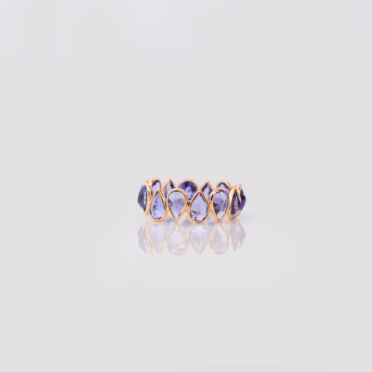 18K gold eternity ring with bezel-set pear-cut tanzanite stones