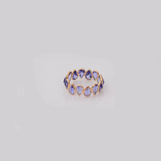 18K gold eternity ring with bezel-set pear-cut tanzanite stones