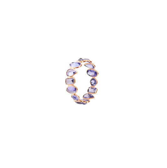 18K gold eternity ring with mixed-cut tanzanite stones in a mosaic pattern