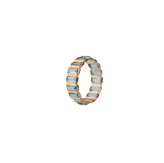 18K gold eternity ring with baguette-cut Swiss blue topaz stones