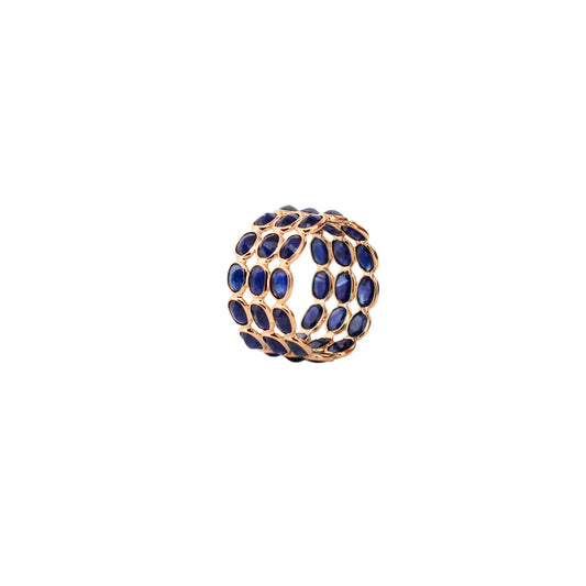 18K gold wide cocktail ring with three rows of bezel-set blue sapphires