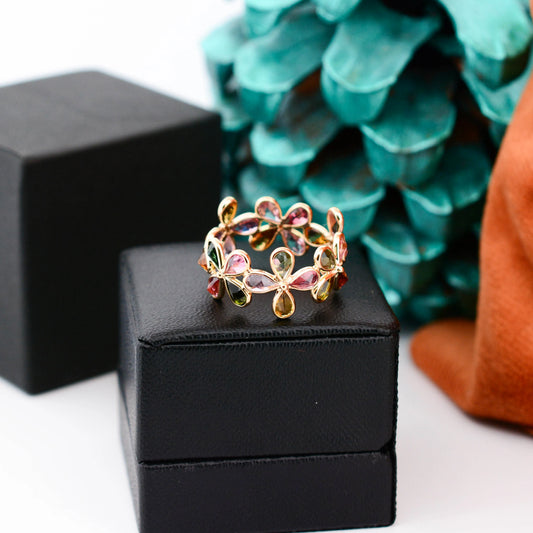 18K gold ring with pear-cut multicolor tourmaline in a floral cluster design