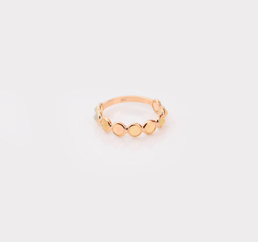 18K gold eternity ring with bezel-set opals and diamond accents