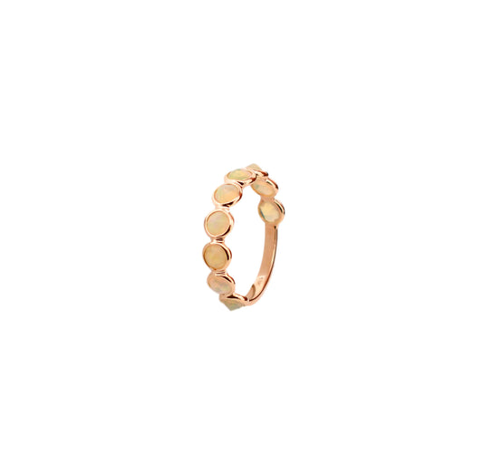 18K gold eternity ring with bezel-set opals and diamond accents