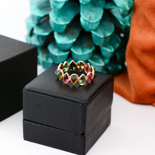 18K gold eternity ring with multicolor pear-cut tourmaline stones