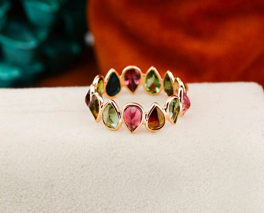 18K gold eternity ring with multicolor pear-cut tourmaline stones