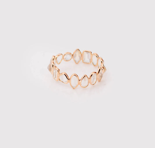18K gold eternity ring with mixed-cut rainbow moonstone stones