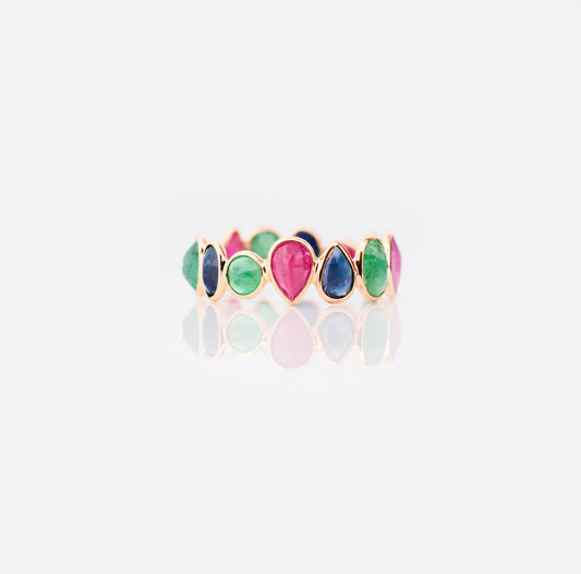 18K gold eternity ring with mixed sapphire, emerald, and ruby gemstones