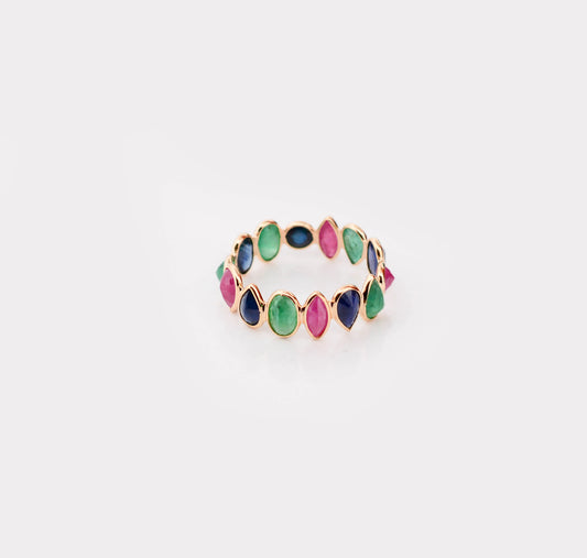 18K gold eternity ring with mixed sapphire, emerald, and ruby gemstones