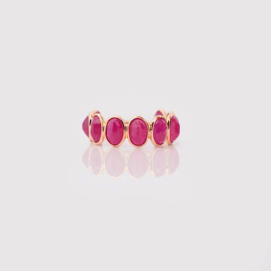 18K gold eternity ring with bezel-set oval-cut rubies