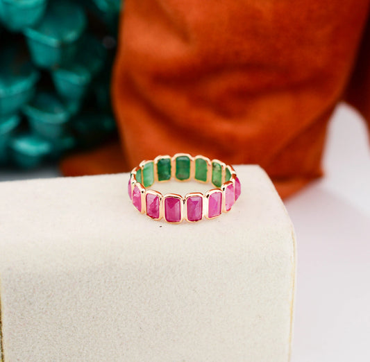 18K gold eternity ring with emerald-cut emerald and ruby stones in a two-tone design