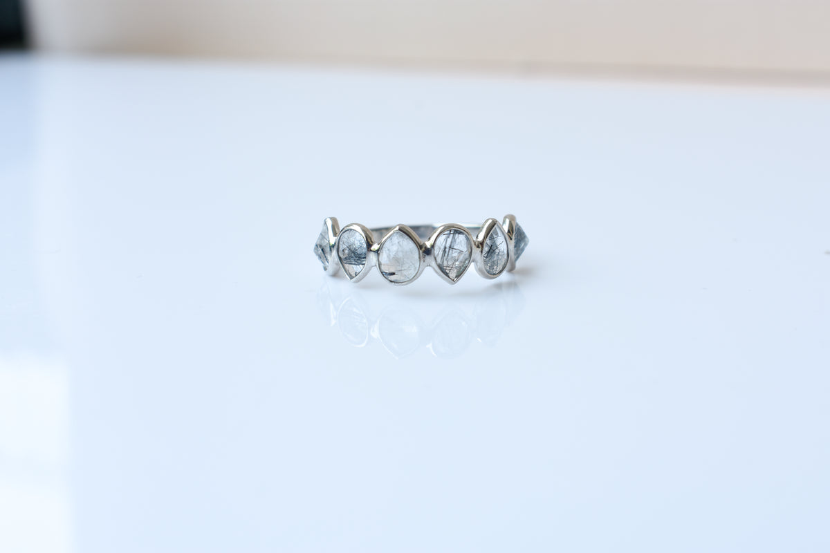Rutilated quartz eternity band ring in 925 silver