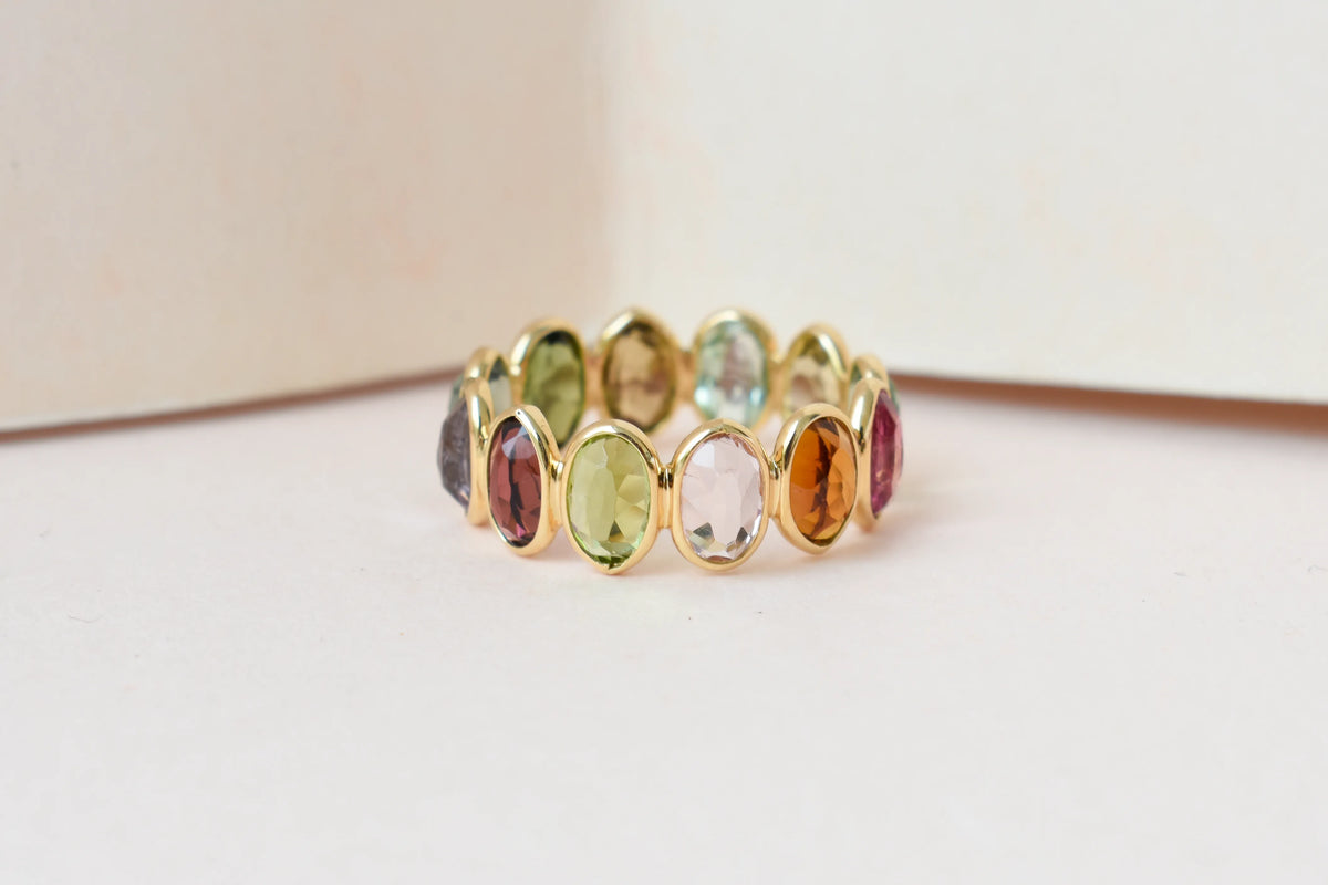 Oval-cut multicolor tourmaline double-row eternity ring in 18K gold