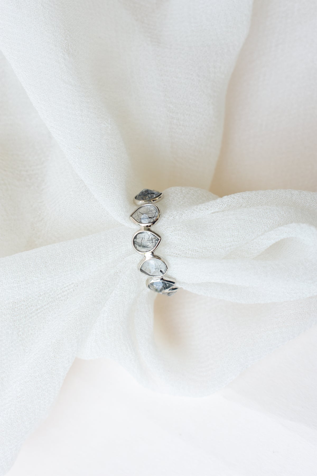 Rutilated quartz eternity band ring in 925 silver