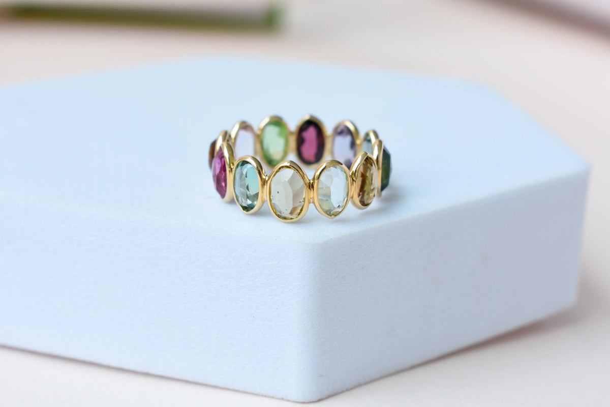 Oval-cut multicolor tourmaline double-row eternity ring in 18K gold